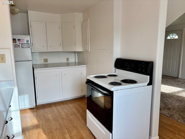 196 Northeast Flagg Street Roseburg, OR 97470 - Photo 14 of 27 a stove top oven sitting inside of a kitchen