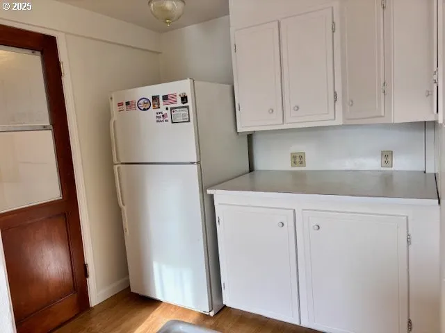 a white refrigerator freezer sitting in a kitchen