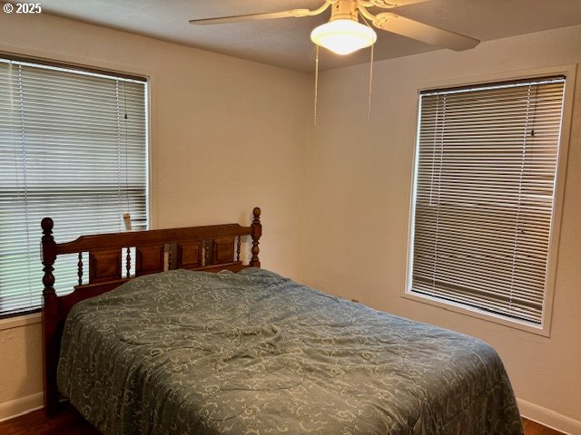196 Northeast Flagg Street Roseburg, OR 97470 - Photo 17 of 27 a bed sitting in a bedroom next to a window