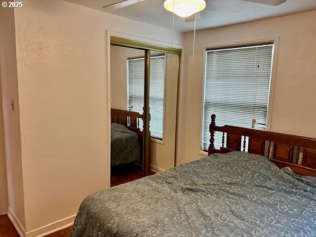 a bedroom with a bed and a table