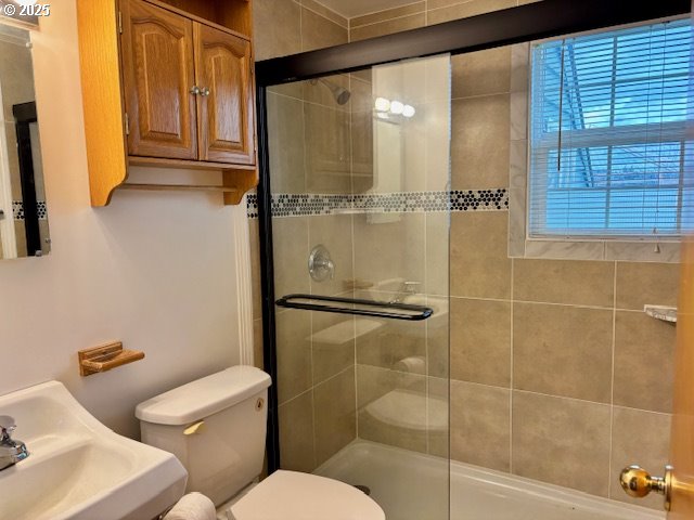 196 Northeast Flagg Street Roseburg, OR 97470 - Photo 19 of 27 a bathroom with a toilet shower vanity and a sink