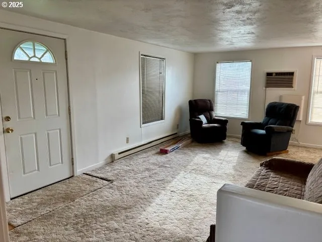 a living room with furniture window and a table