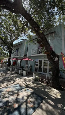 a view of house with car parked
