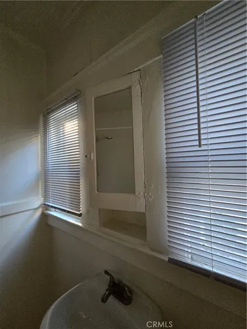 a bathroom with a sink and a window