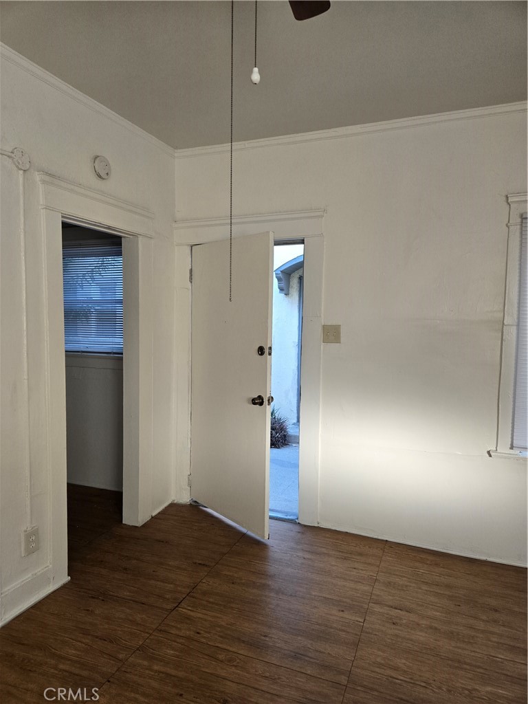 551 West 10th Street, Unit 9 Long Beach, CA 90813 - Photo 5 of 14 an empty room with wooden floor and windows