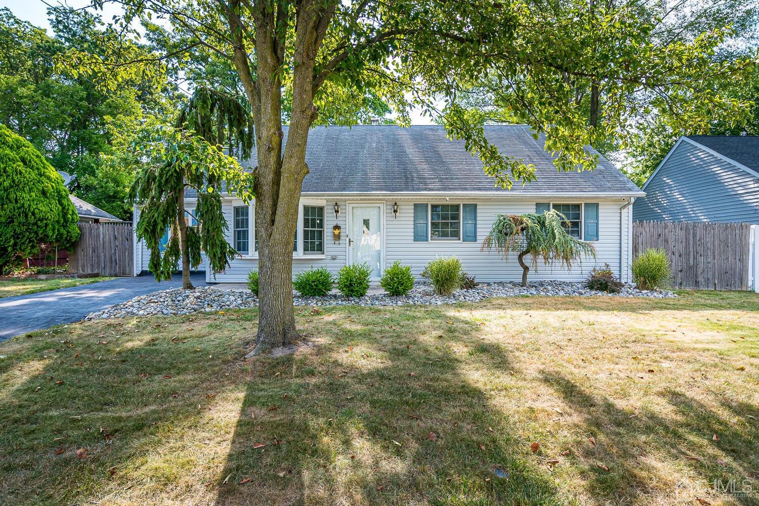 6 Stiles Road Edison, NJ 08817 - Photo 1 of 28 a front view of a house with garden