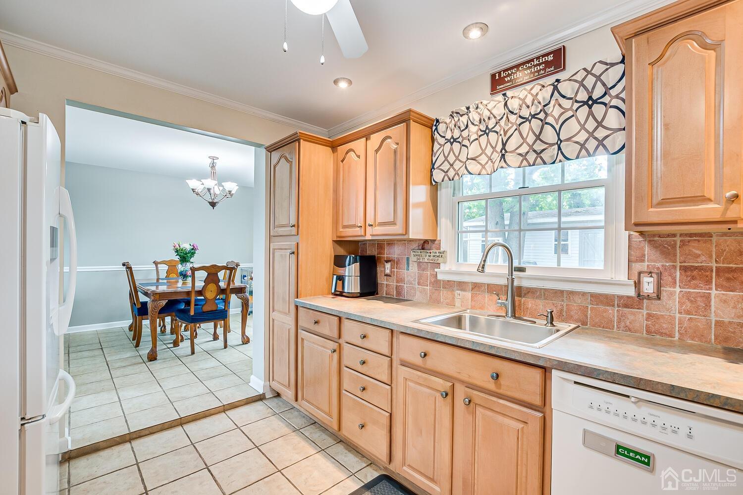 6 Stiles Road Edison, NJ 08817 - Photo 13 of 28 a kitchen with a sink and cabinets