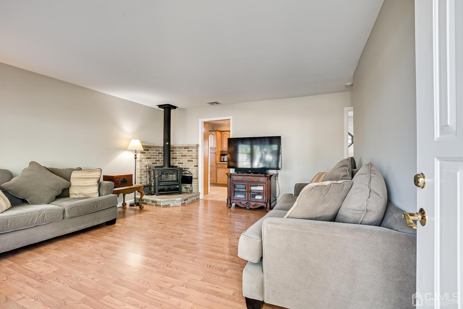 6 Stiles Road Edison, NJ 08817 - Photo 5 of 28 a living room with furniture and a flat screen tv
