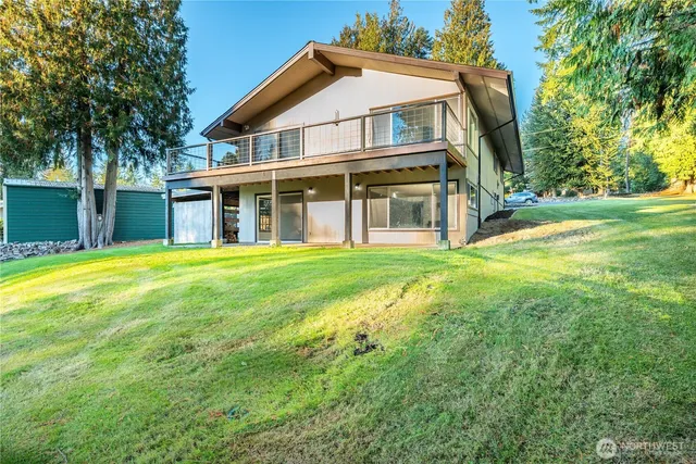 a view of a backyard with a garden and trees