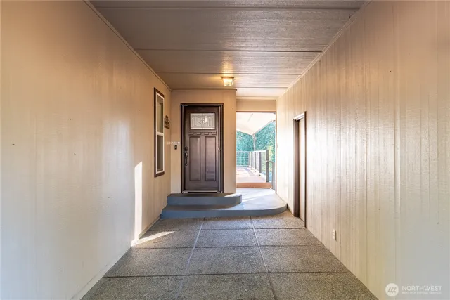 a view of a hallway with windows