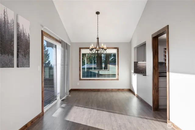 a view of a room with window wooden floor and outdoor space
