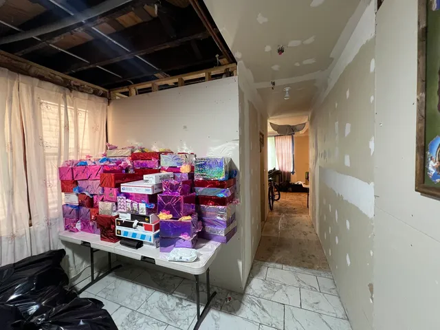 a room with lots of furniture and a chandelier