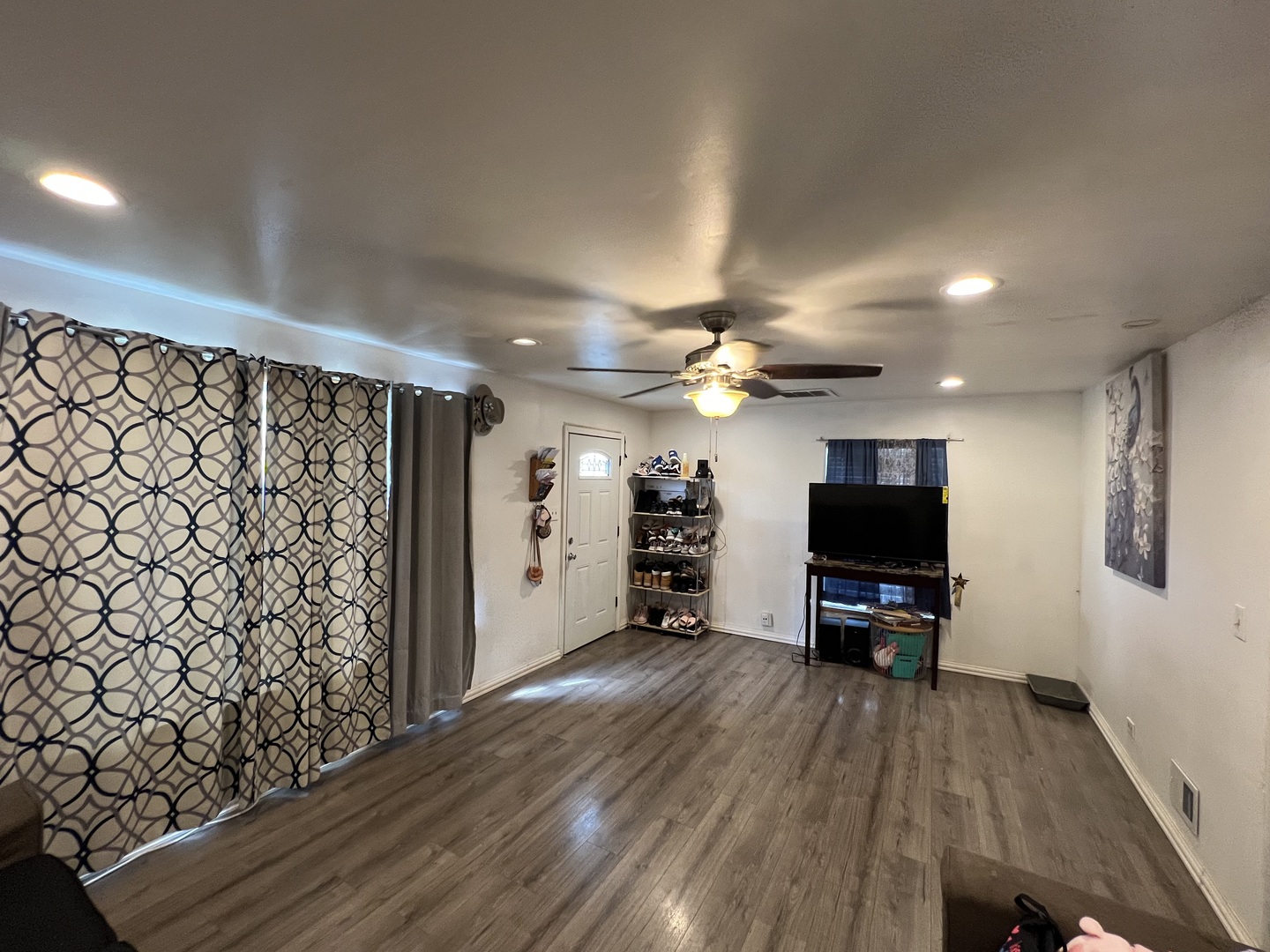 2050 West 52nd Street Chicago, IL 60609 - Photo 4 of 22 a view of a livingroom with wooden floor and a flat screen tv