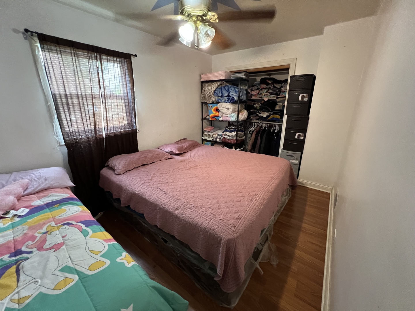 2050 West 52nd Street Chicago, IL 60609 - Photo 5 of 22 a bed sitting in a bedroom next to a window