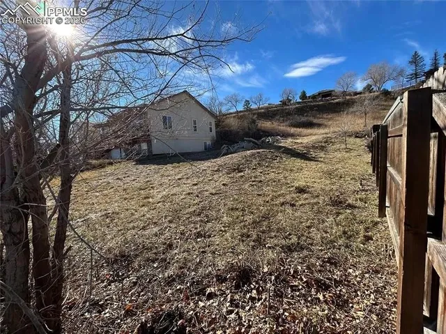 a view of a backyard of the house