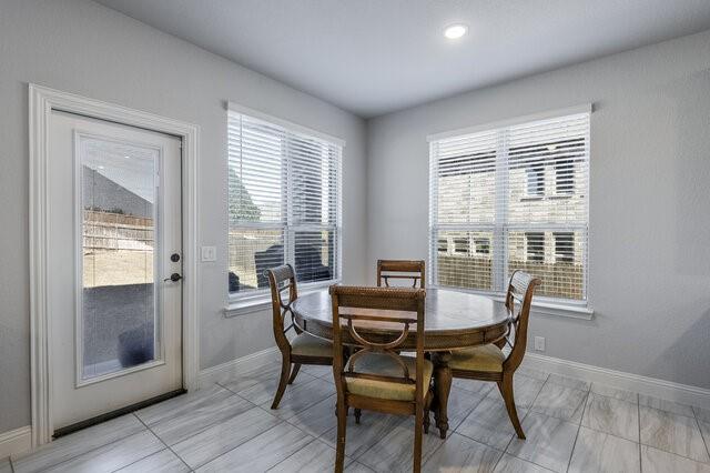 807 Imperial Way Mansfield, TX 76063 - Photo 12 of 39 a view of a dining room with furniture and a window