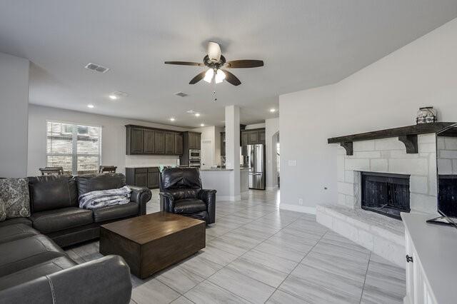 807 Imperial Way Mansfield, TX 76063 - Photo 15 of 39 a living room with furniture and a fireplace