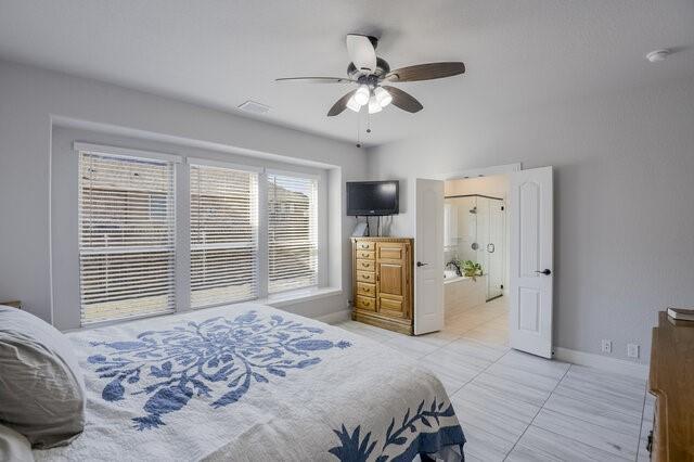 807 Imperial Way Mansfield, TX 76063 - Photo 18 of 39 a bedroom with a bed and a chandelier