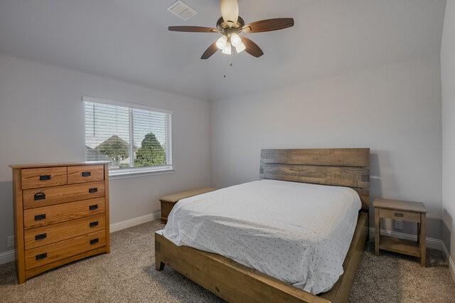 807 Imperial Way Mansfield, TX 76063 - Photo 39 of 39 a bedroom with a bed a chandelier and a window