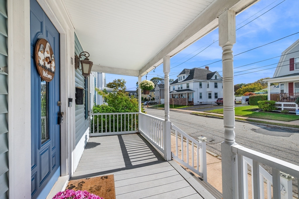 a view of a balcony with wooden floor