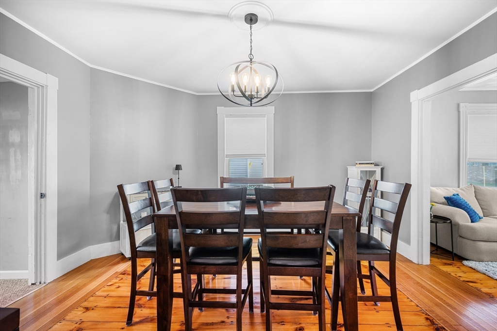 13 State Street Peabody, MA 01960 - Photo 11 of 42 a view of a dining room with furniture window and wooden floor