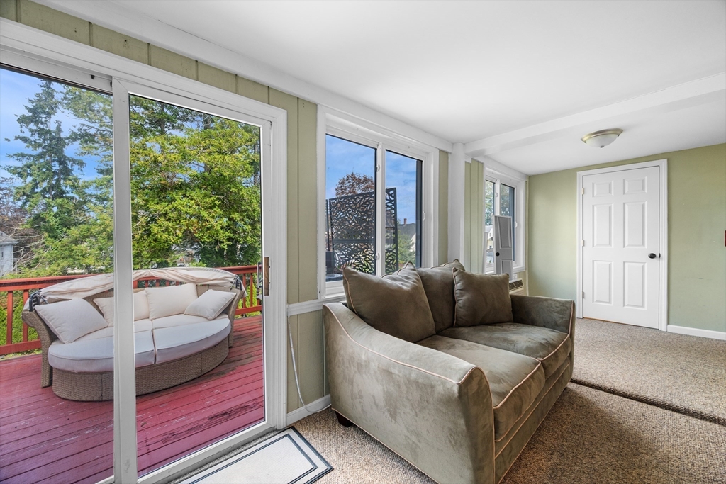 13 State Street Peabody, MA 01960 - Photo 14 of 42 a living room with furniture and a large window