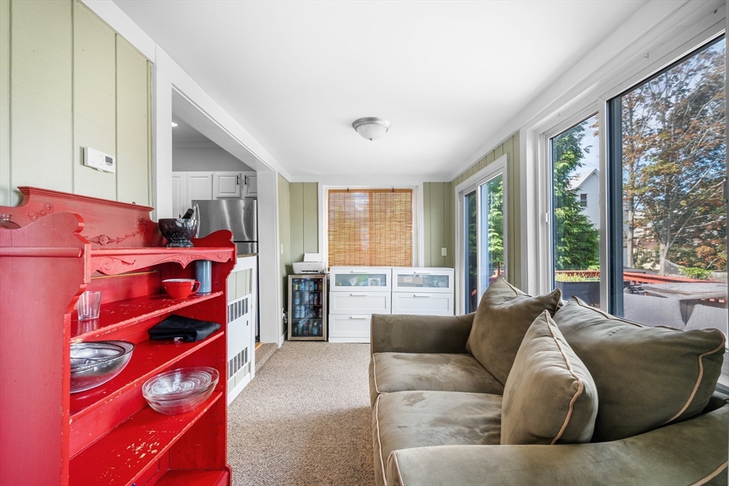 13 State Street Peabody, MA 01960 - Photo 16 of 42 a living room with furniture and a large window
