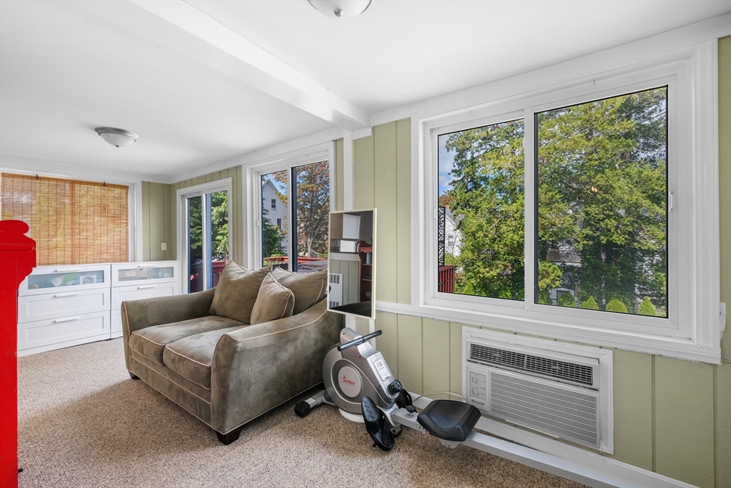 13 State Street Peabody, MA 01960 - Photo 17 of 42 a living room with furniture and a window
