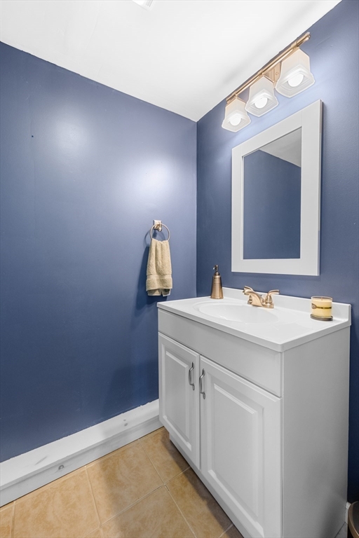 13 State Street Peabody, MA 01960 - Photo 18 of 42 a bathroom with a sink and a mirror