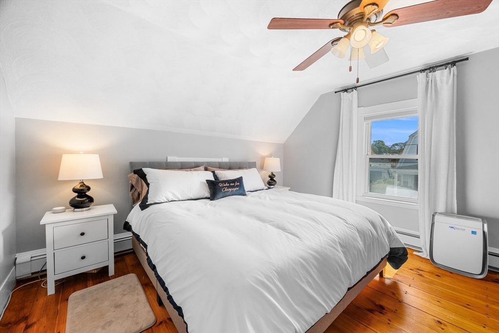 13 State Street Peabody, MA 01960 - Photo 20 of 42 a bedroom with bed and window