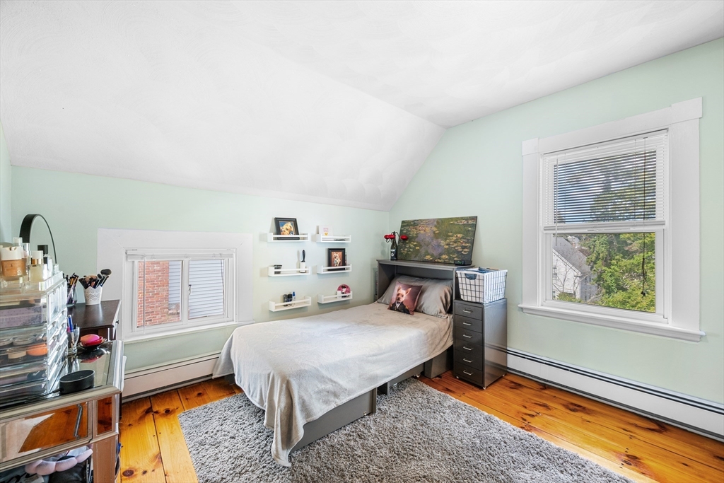 13 State Street Peabody, MA 01960 - Photo 27 of 42 a bedroom with a bed and a window