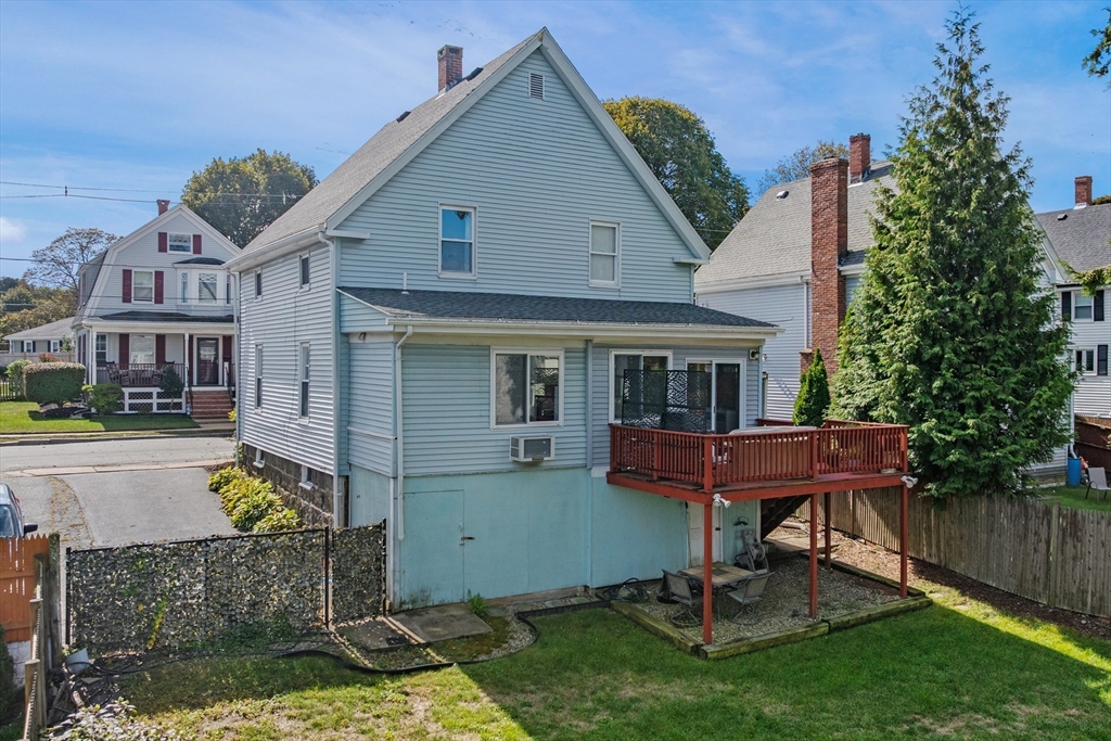 13 State Street Peabody, MA 01960 - Photo 32 of 42 a front view of a house with a yard table and chairs