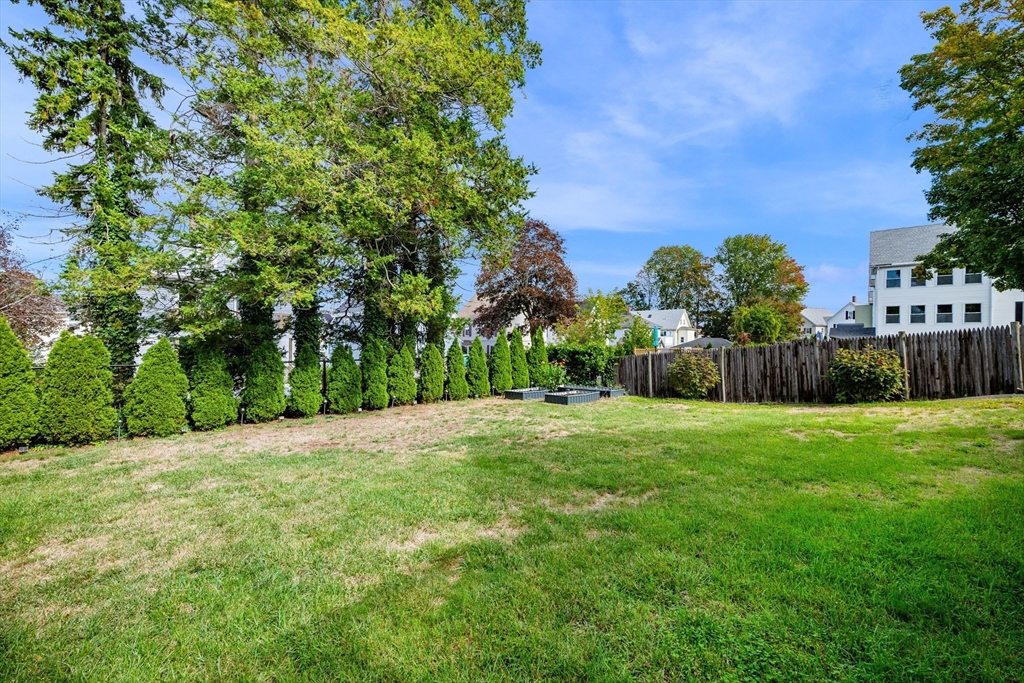 13 State Street Peabody, MA 01960 - Photo 34 of 42 a backyard of a house with lots of green space