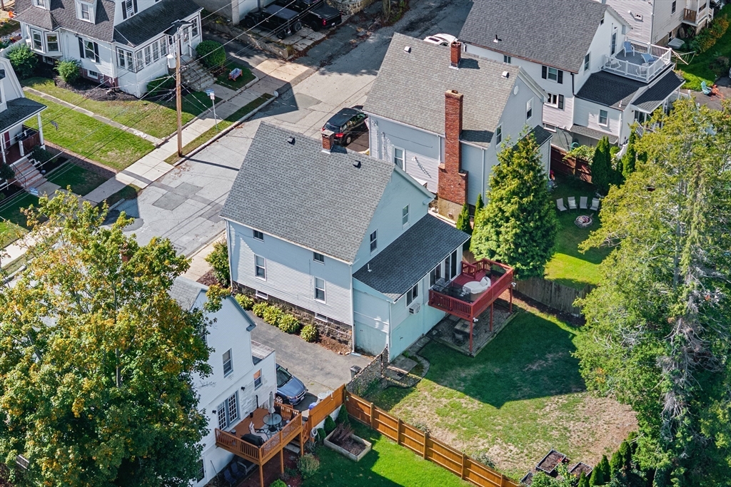 13 State Street Peabody, MA 01960 - Photo 36 of 42 an aerial view of a house with a yard basket ball court and outdoor seating