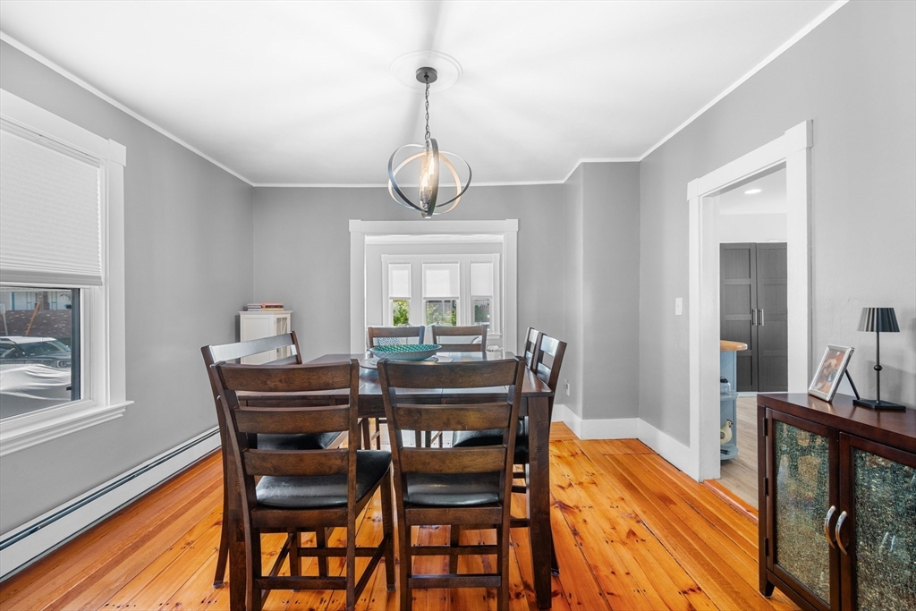 13 State Street Peabody, MA 01960 - Photo 10 of 42 a view of a dining room with furniture window and wooden floor