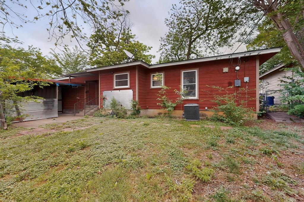 4508 Rutland Avenue Fort Worth, TX 76133 - Photo 33 of 36 a backyard of a house with wooden fence and large trees