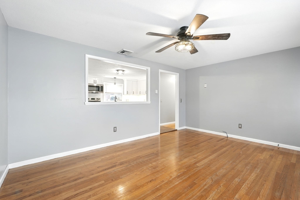 37 Gourley Road Springfield, MA 01129 - Photo 16 of 41 an empty room with wooden floor fan and windows