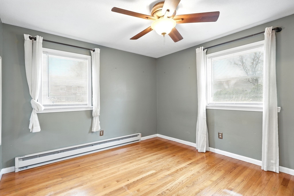 37 Gourley Road Springfield, MA 01129 - Photo 19 of 41 a view of an empty room with wooden floor and a window