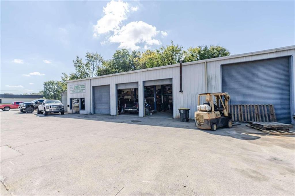 1103 Shorter Avenue Rome, GA 30165 - Photo 2 of 11 a view of a patio with table and chairs and a large tree
