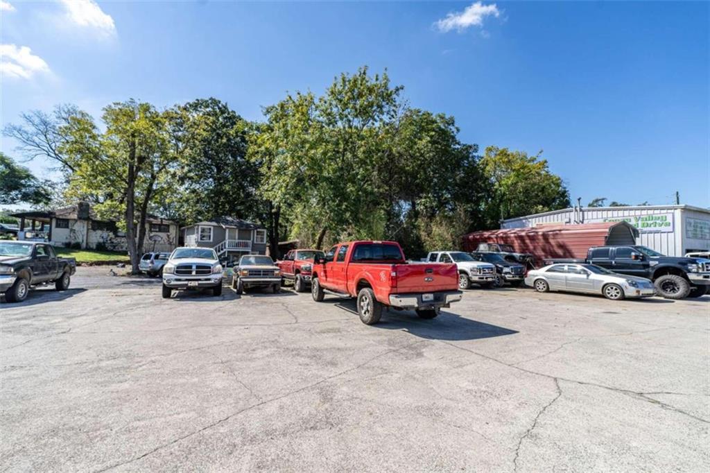 1103 Shorter Avenue Rome, GA 30165 - Photo 7 of 11 a view of cars parked in a parking lot