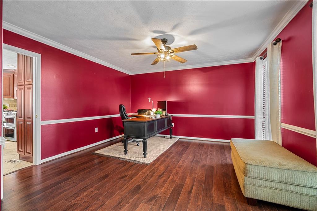 121 Tiffany Ridge Drive Coraopolis, PA 15108 - Photo 11 of 28 The formal dining room is currently used as a home office. It offers vinyl hardwood flooring, crown molding, a chair rail and a ceiling fan light.