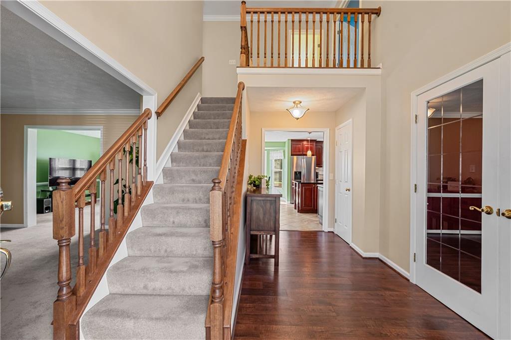 121 Tiffany Ridge Drive Coraopolis, PA 15108 - Photo 3 of 28 The open two story entry includes vinyl hardwood floors and neutral décor. French doors lead to the formal dining room.