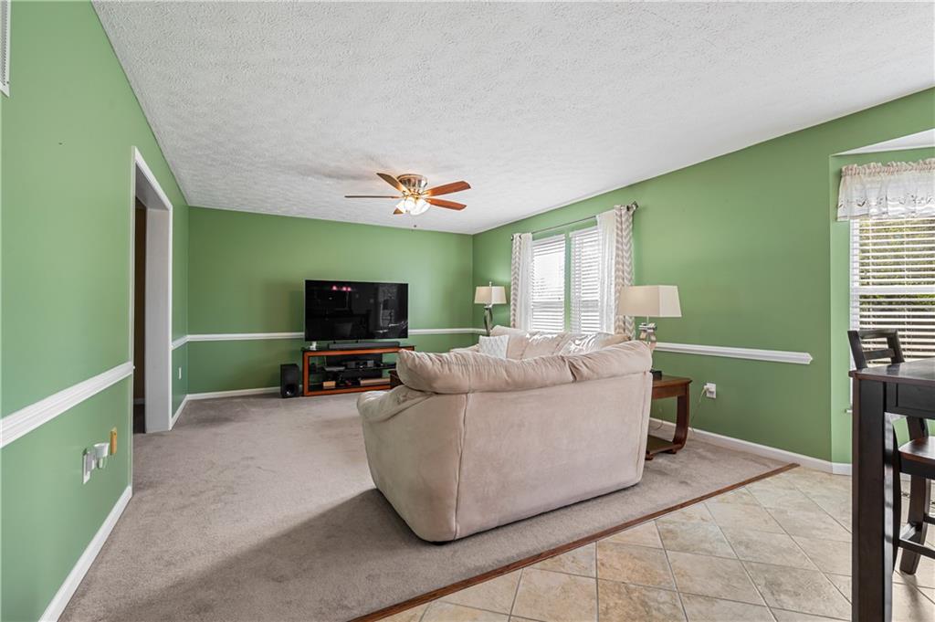 121 Tiffany Ridge Drive Coraopolis, PA 15108 - Photo 8 of 28 The family room opens into the formal living room.
