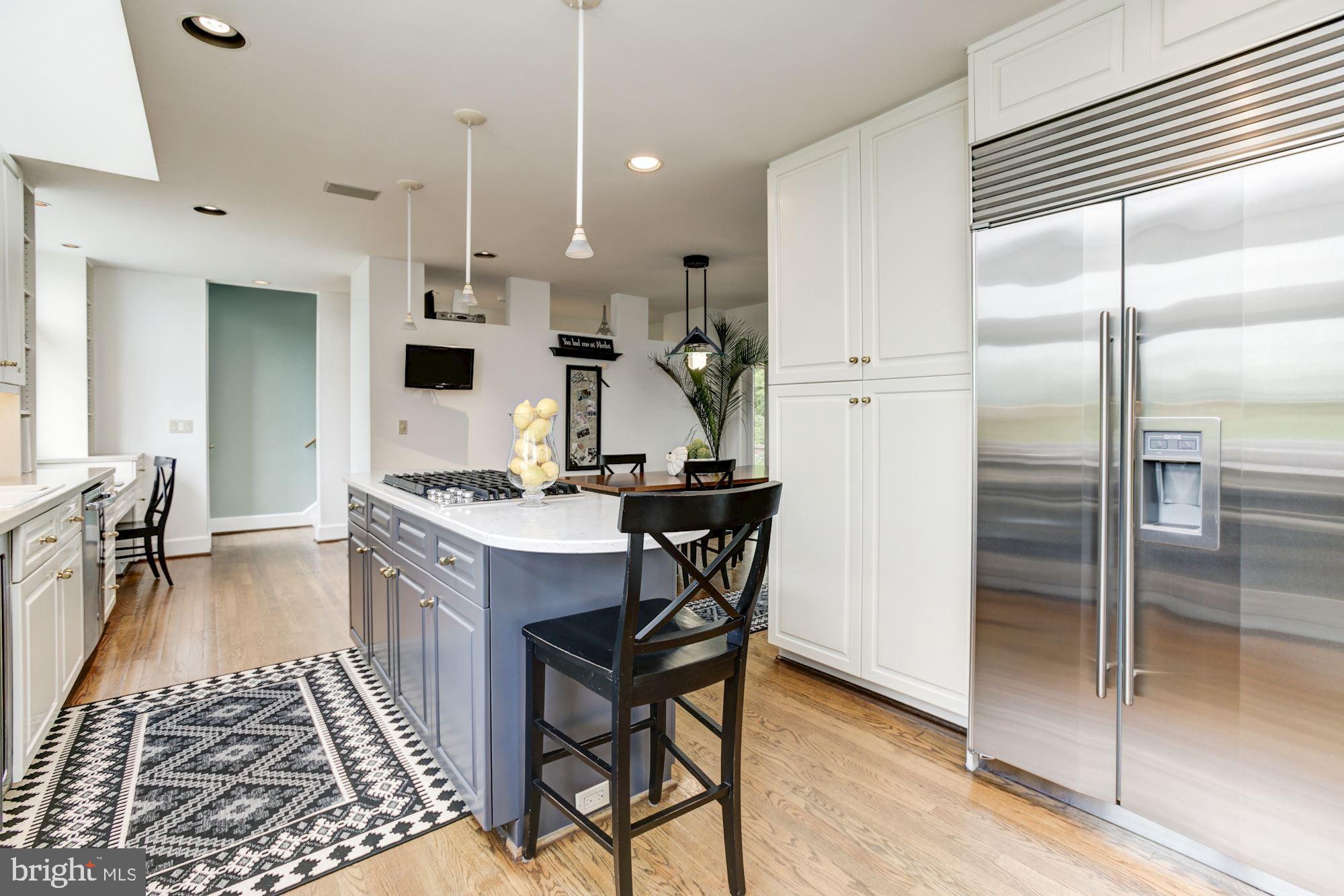 302 Rugby Cove Arnold, MD 21012 - Photo 29 of 61 Kitchen island with granite counter & gas cooktop