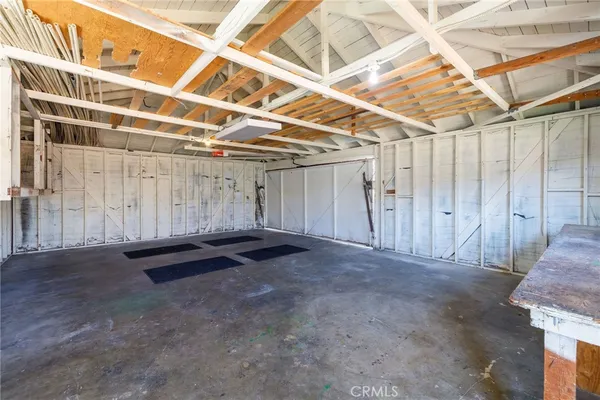 a view of an empty room with wooden walls