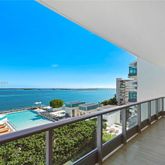 a view of a balcony with an ocean