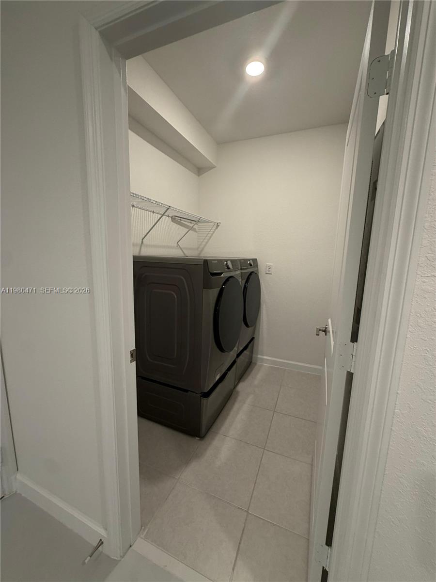 16751 Southwest 291st Terrace, Unit 16751 Homestead, FL 33030 - Photo 11 of 20 a utility room with dryer and washer