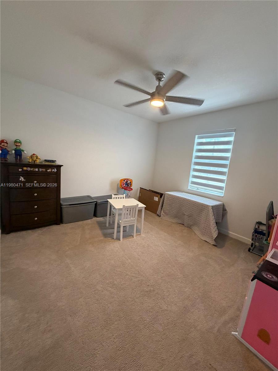 16751 Southwest 291st Terrace, Unit 16751 Homestead, FL 33030 - Photo 16 of 20 a living room with furniture
