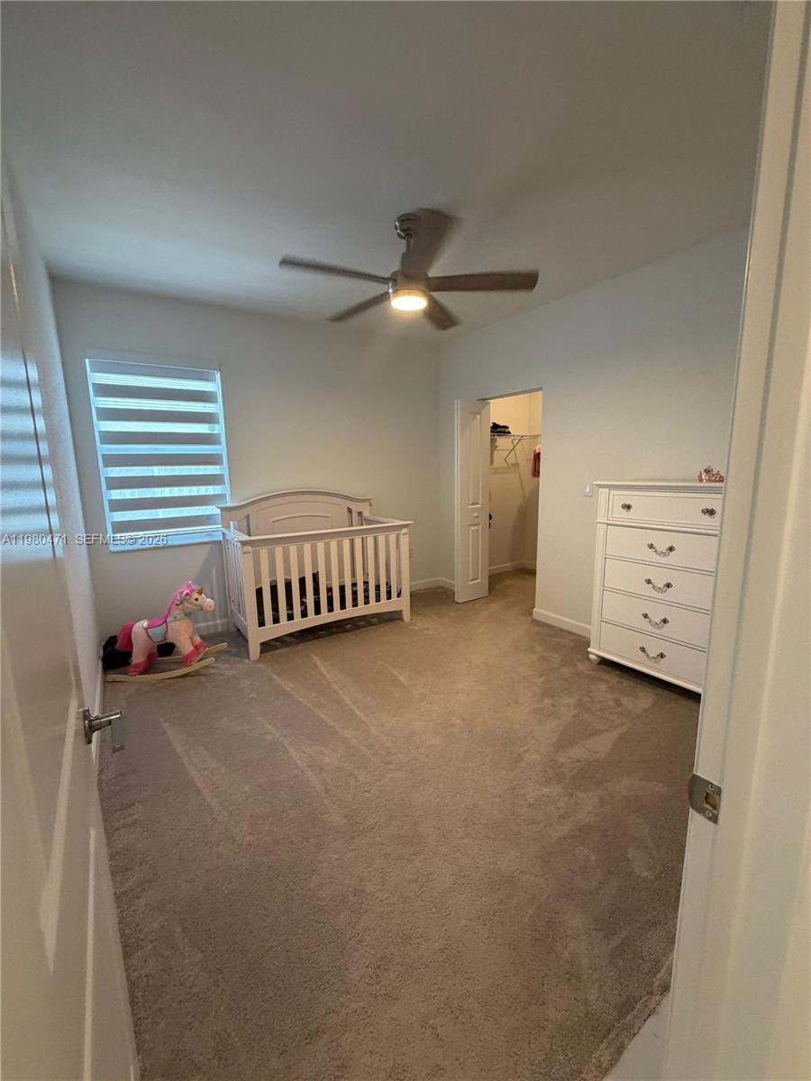 16751 Southwest 291st Terrace, Unit 16751 Homestead, FL 33030 - Photo 19 of 20 a view of a livingroom with furniture and a ceiling fan