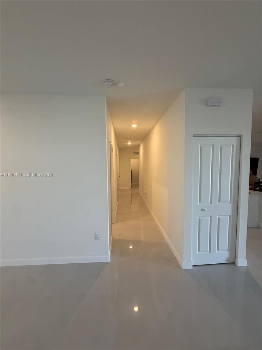 16751 Southwest 291st Terrace, Unit 16751 Homestead, FL 33030 - Photo 6 of 20 a view of a hallway